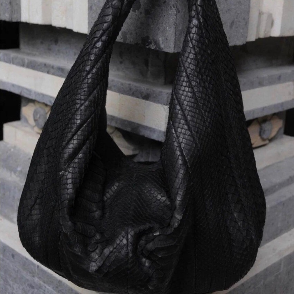 Authentic python skin with leather. Brand new condition. Worn twice.
